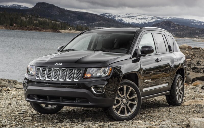 Black Jeep Compass by a lake