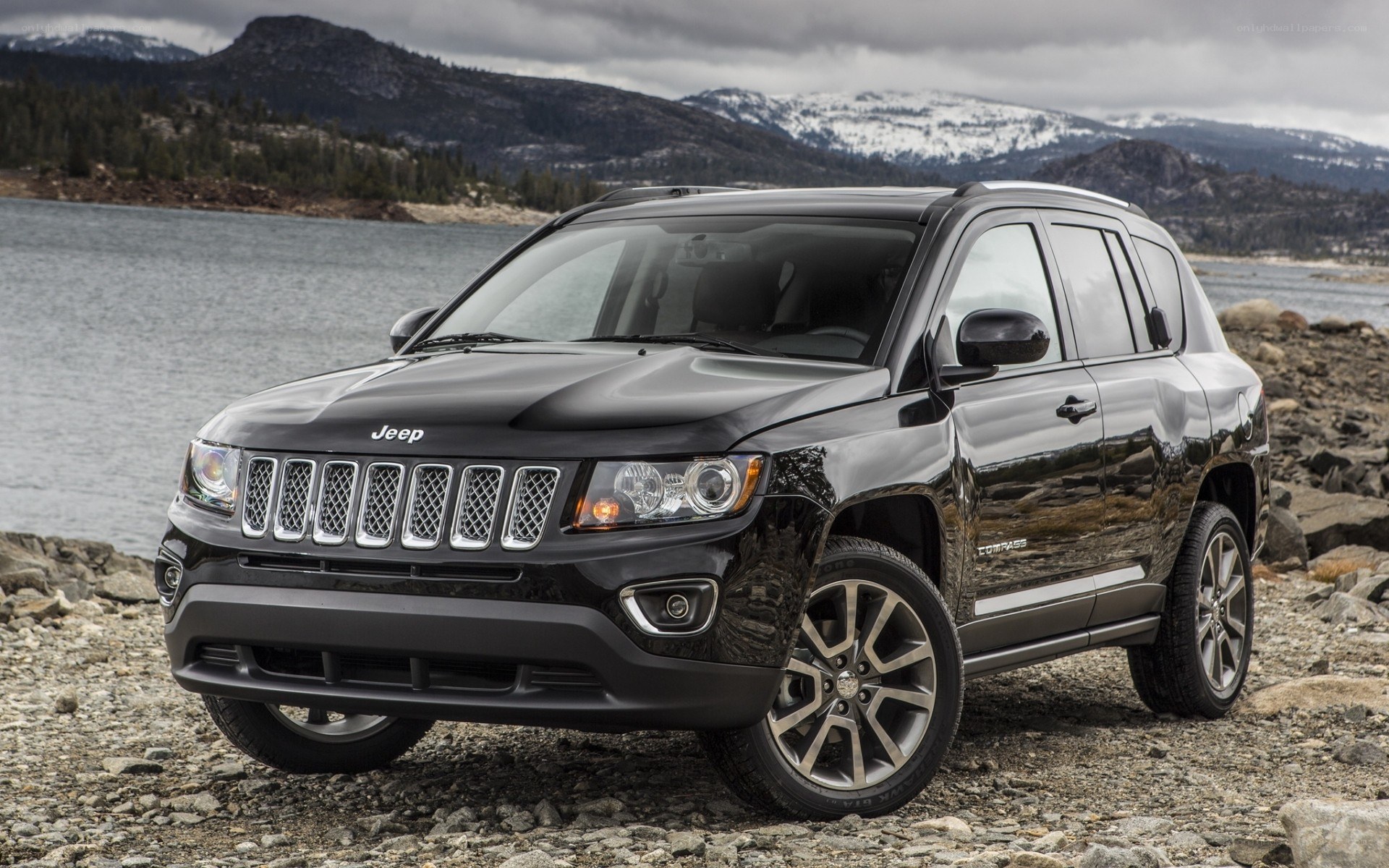Black Jeep Compass by a lake