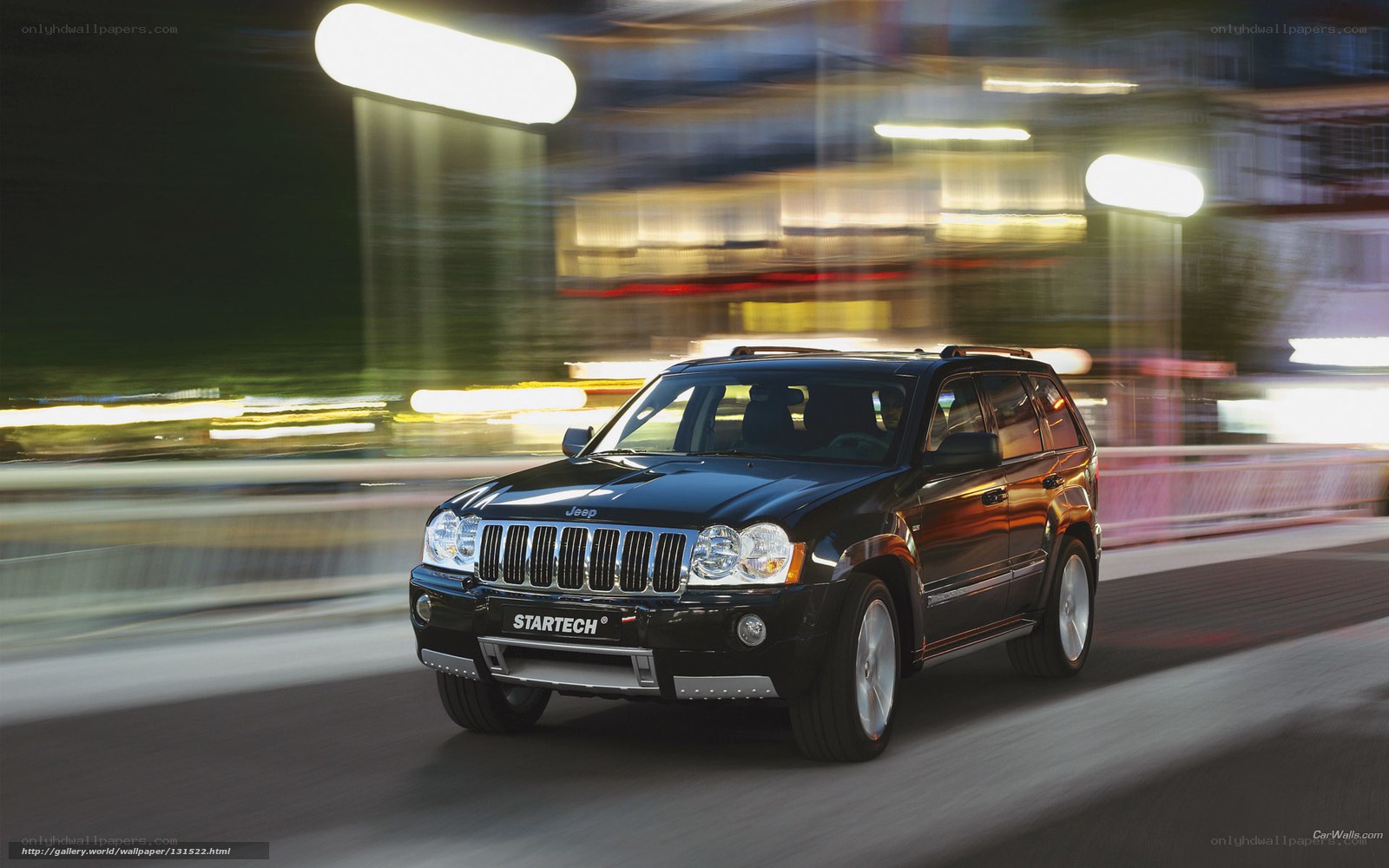 Black Jeep driving at night