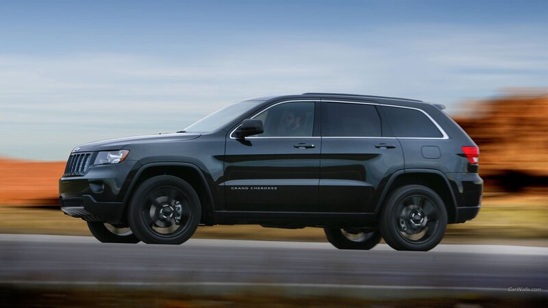 Black Jeep Grand Cherokee in motion