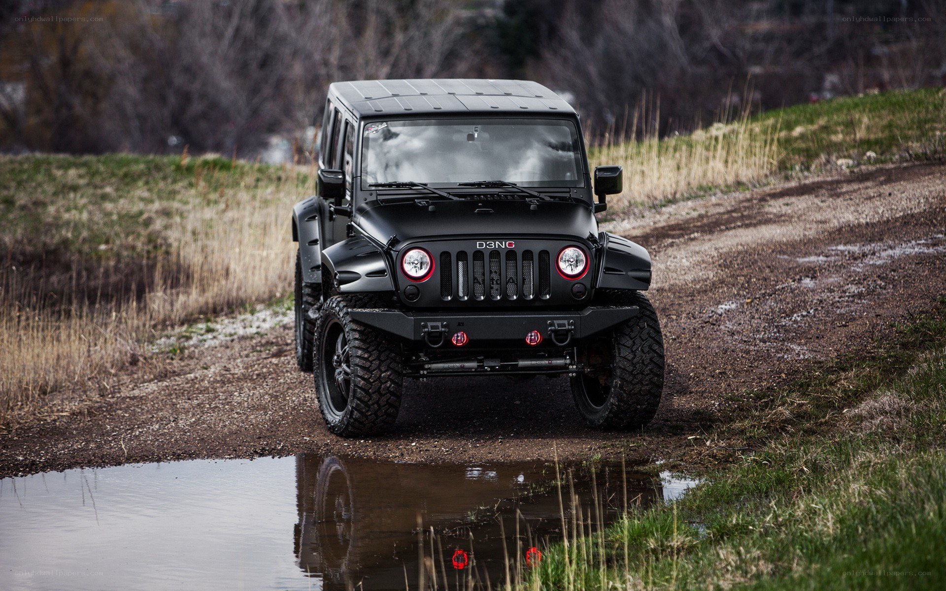 Black Jeep on a muddy trail