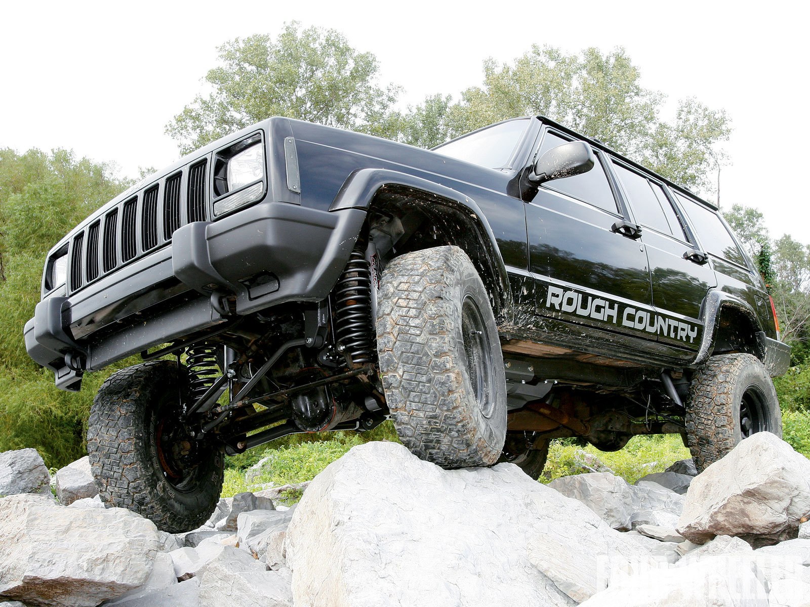 Black Jeep on rocky terrain