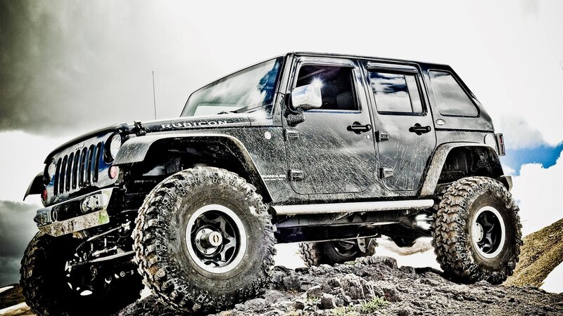Black Jeep Rubicon on rocky terrain