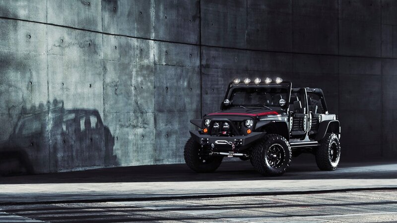 Black Jeep Wrangler in concrete garage