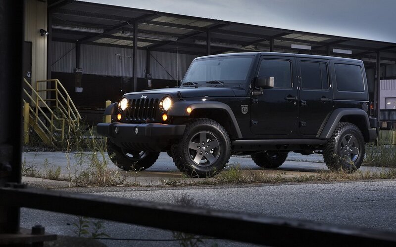 Black Jeep Wrangler in industrial setting