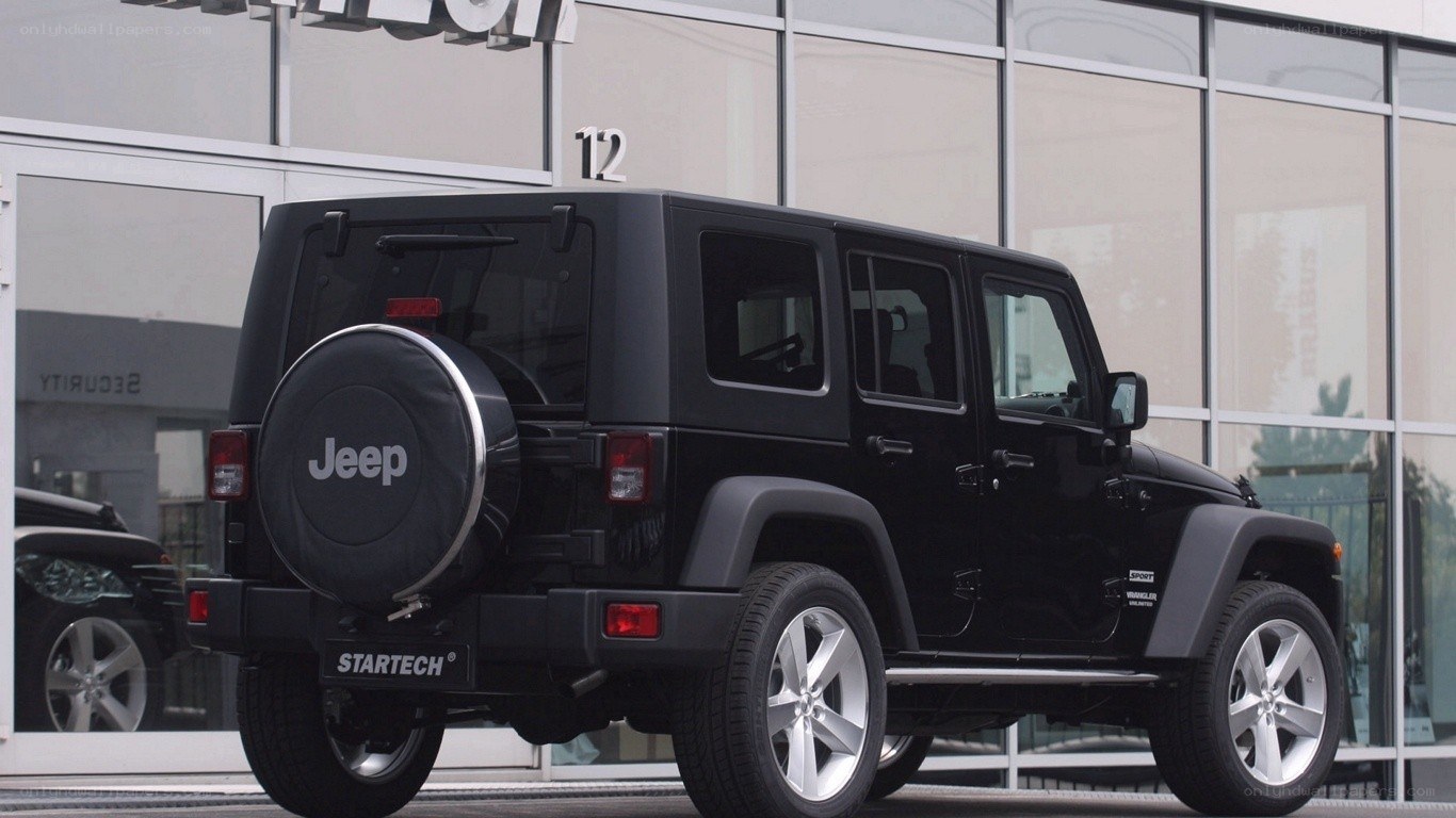 Black Jeep Wrangler parked outside