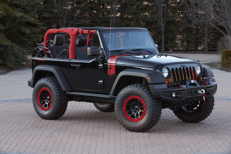 black jeep wrangler with red accents