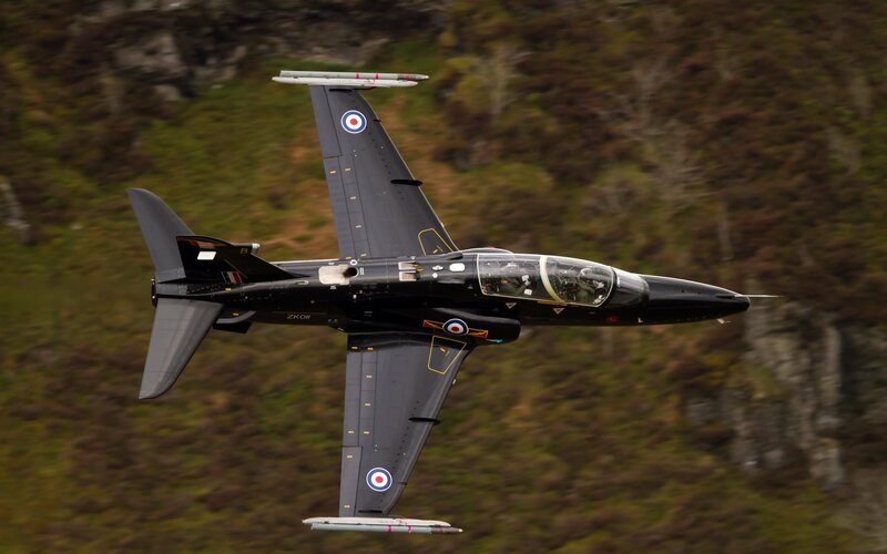 Black Jet Aircraft — Dynamic, Photograph, Mountain