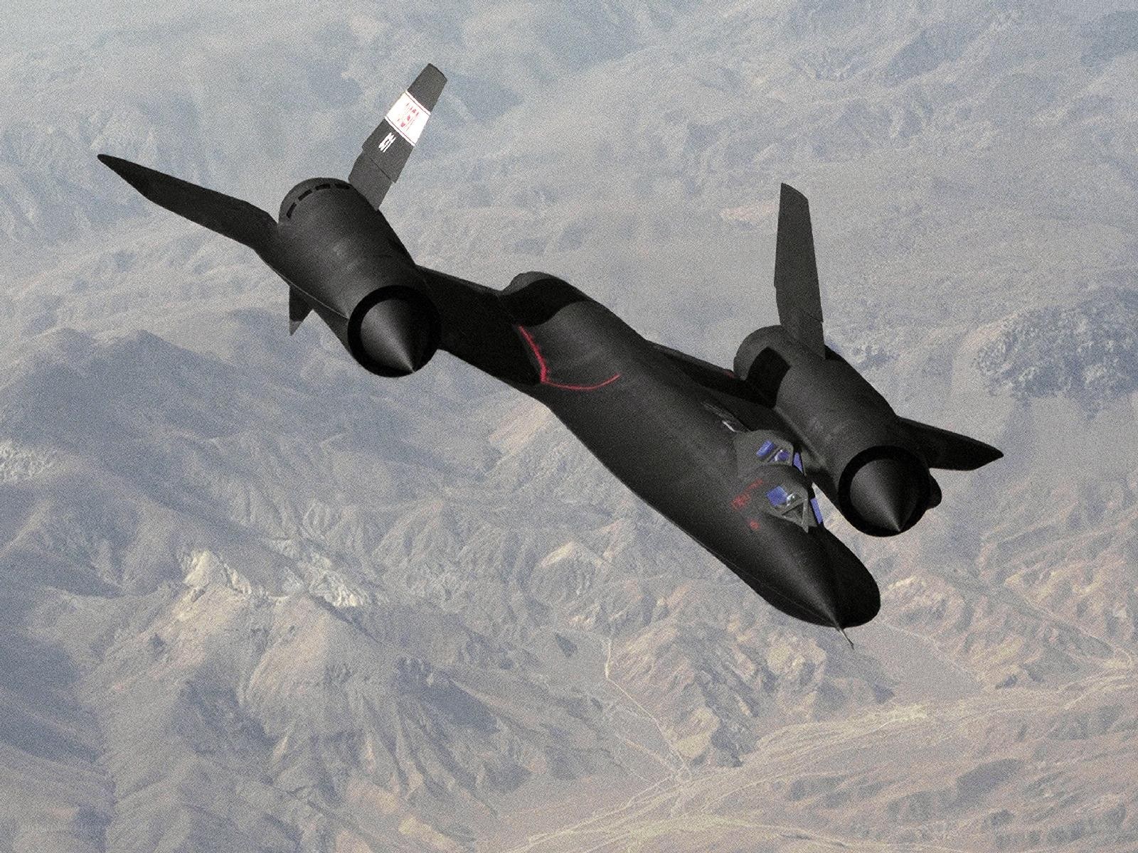 Black jet aircraft in flight