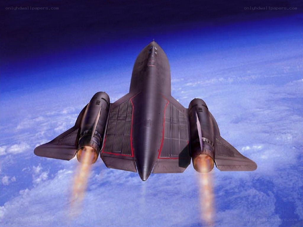 Black jet flying above clouds
