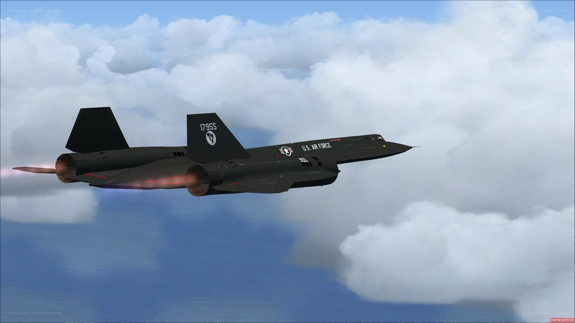 Black jet flying above clouds