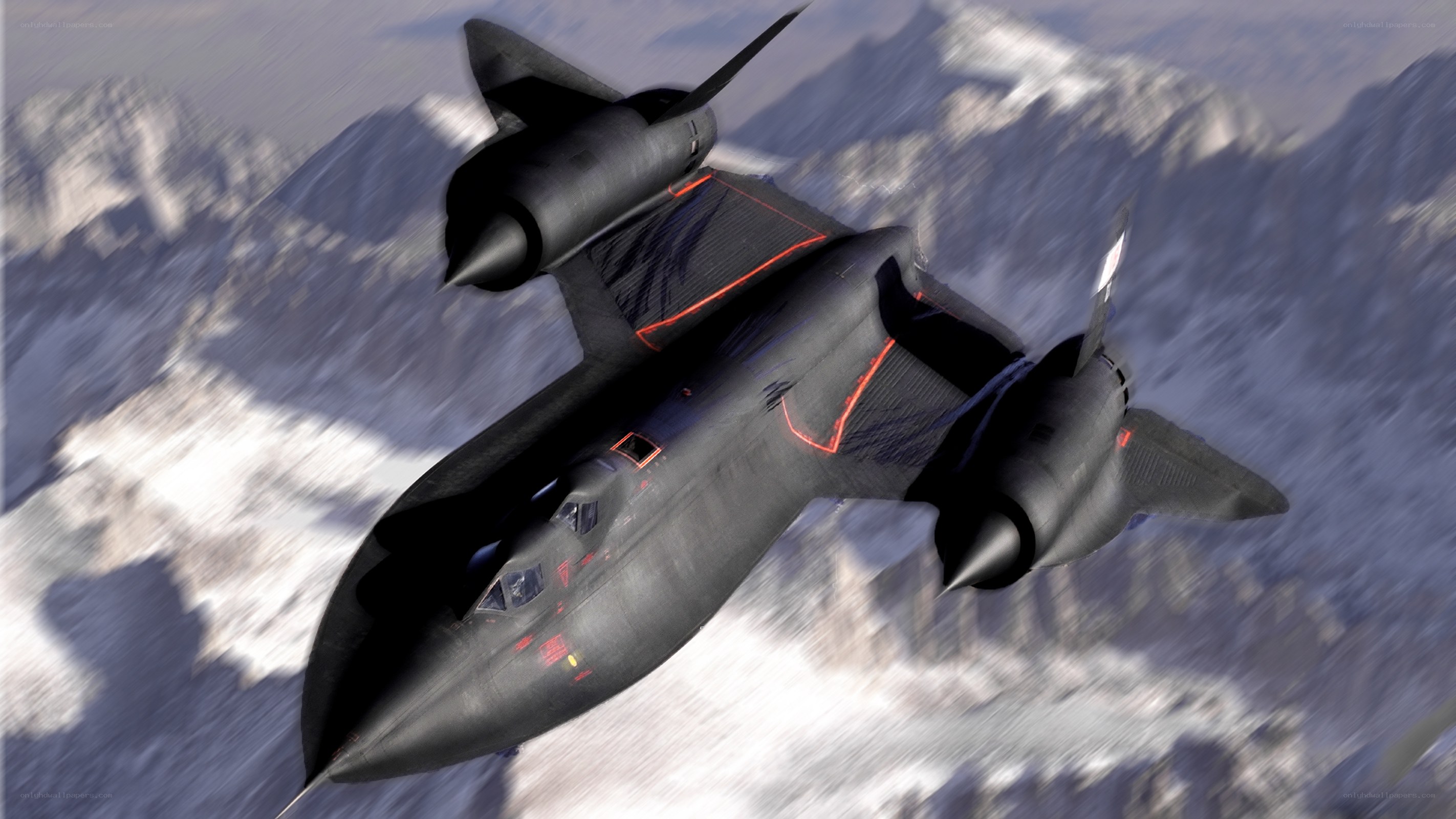 Black jet flying over mountains