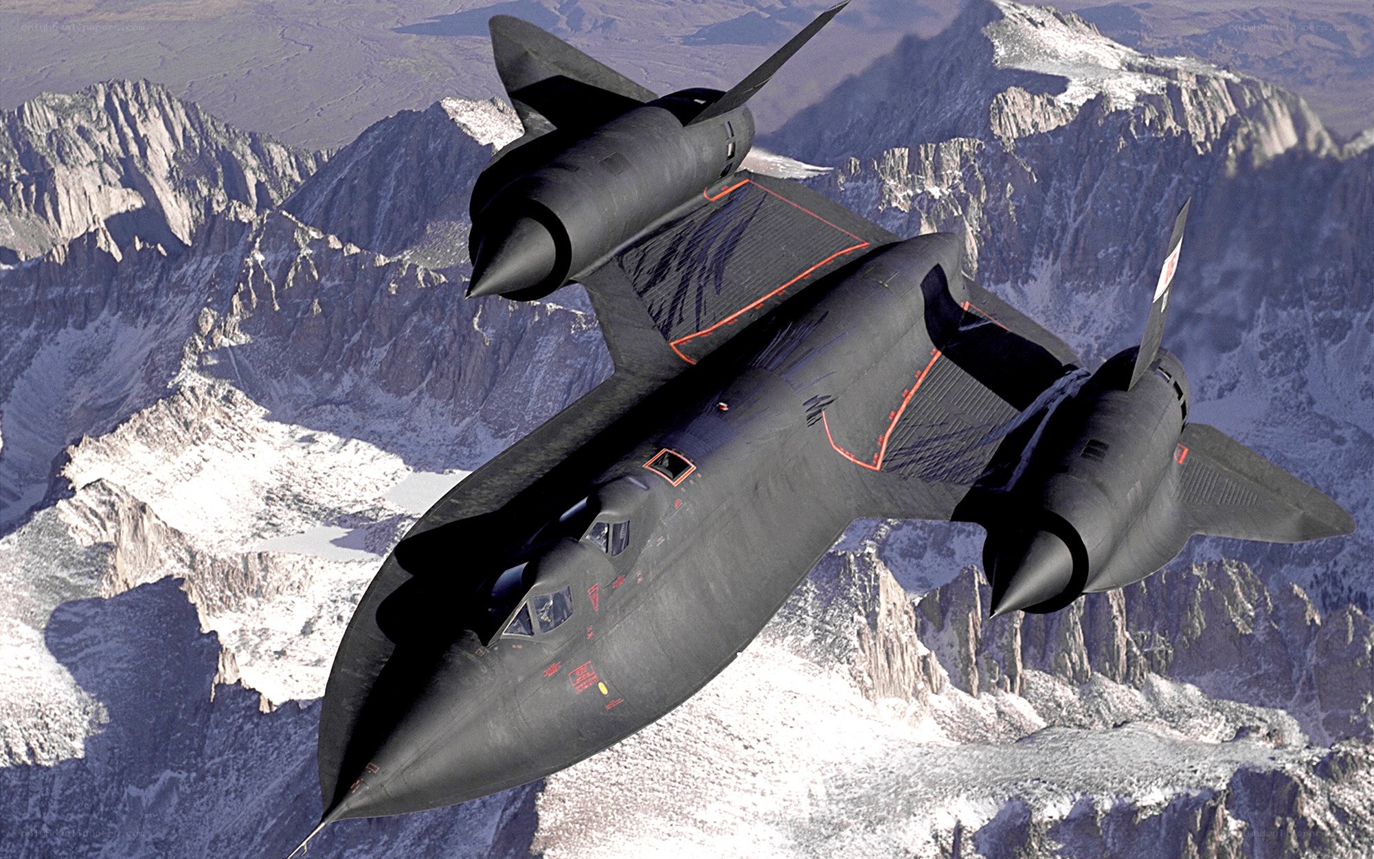 Black jet flying over mountains