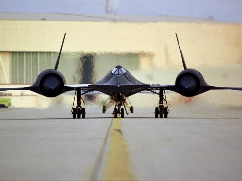 Black jet on runway