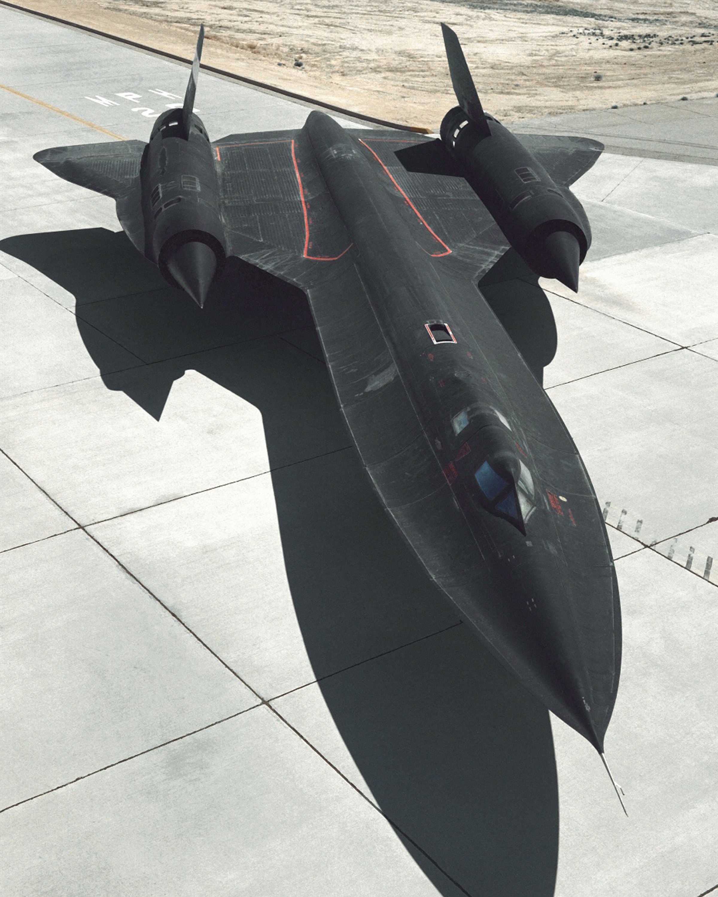 Black jet on tarmac