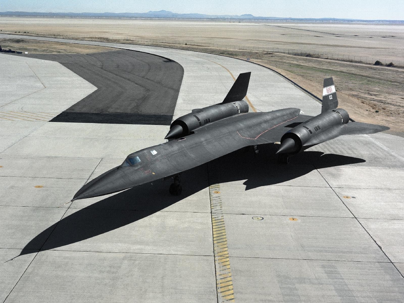Black jet on tarmac