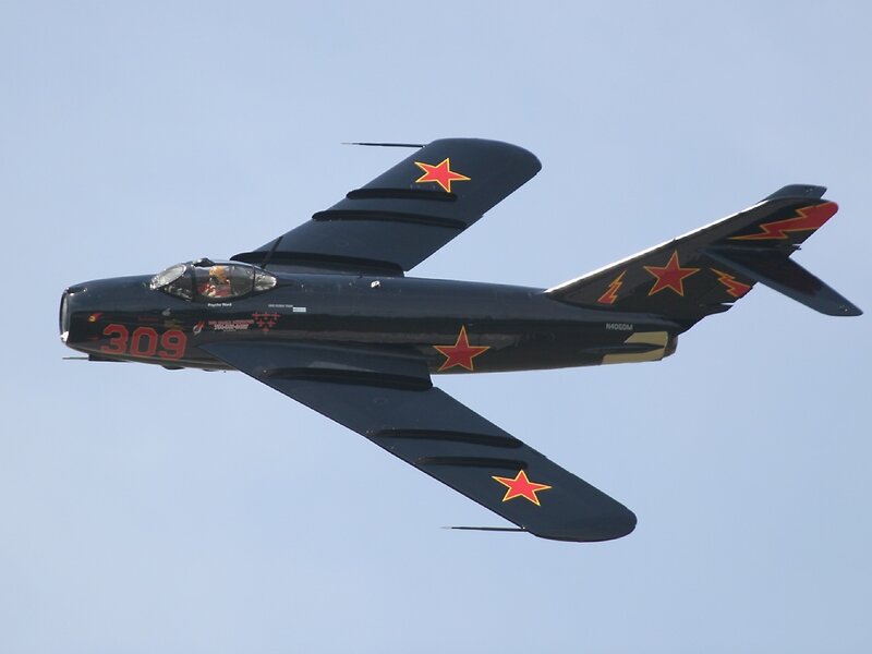 black jet with red stars