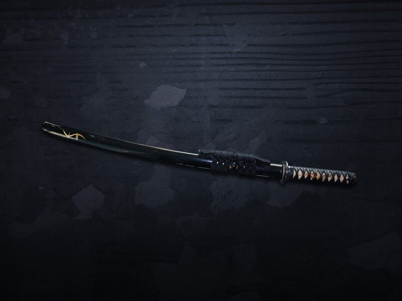 black katana on dark surface