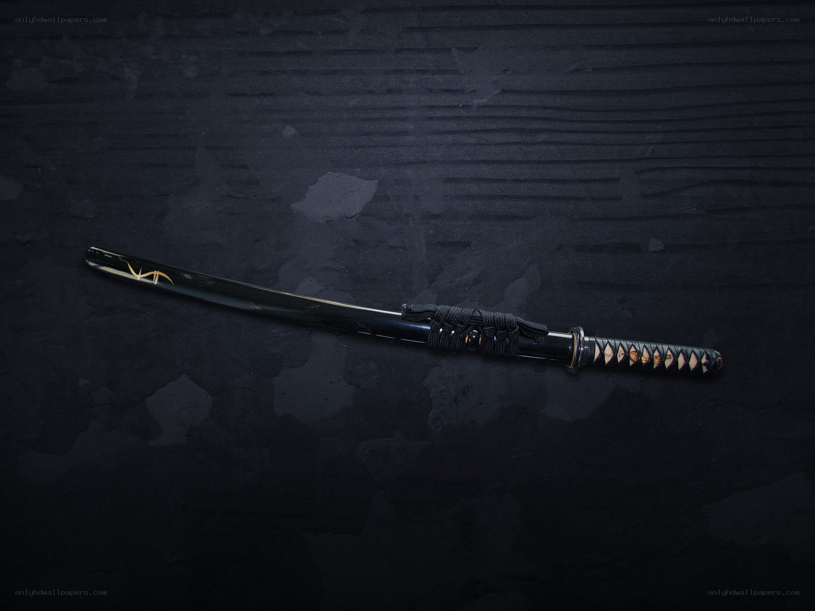 black katana on dark surface