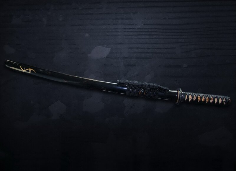 Black katana with gold details
