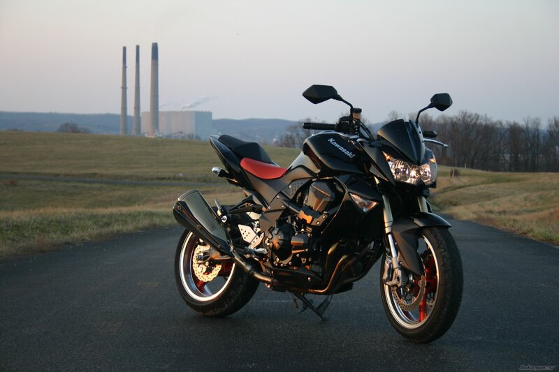 Black Kawasaki motorcycle on road