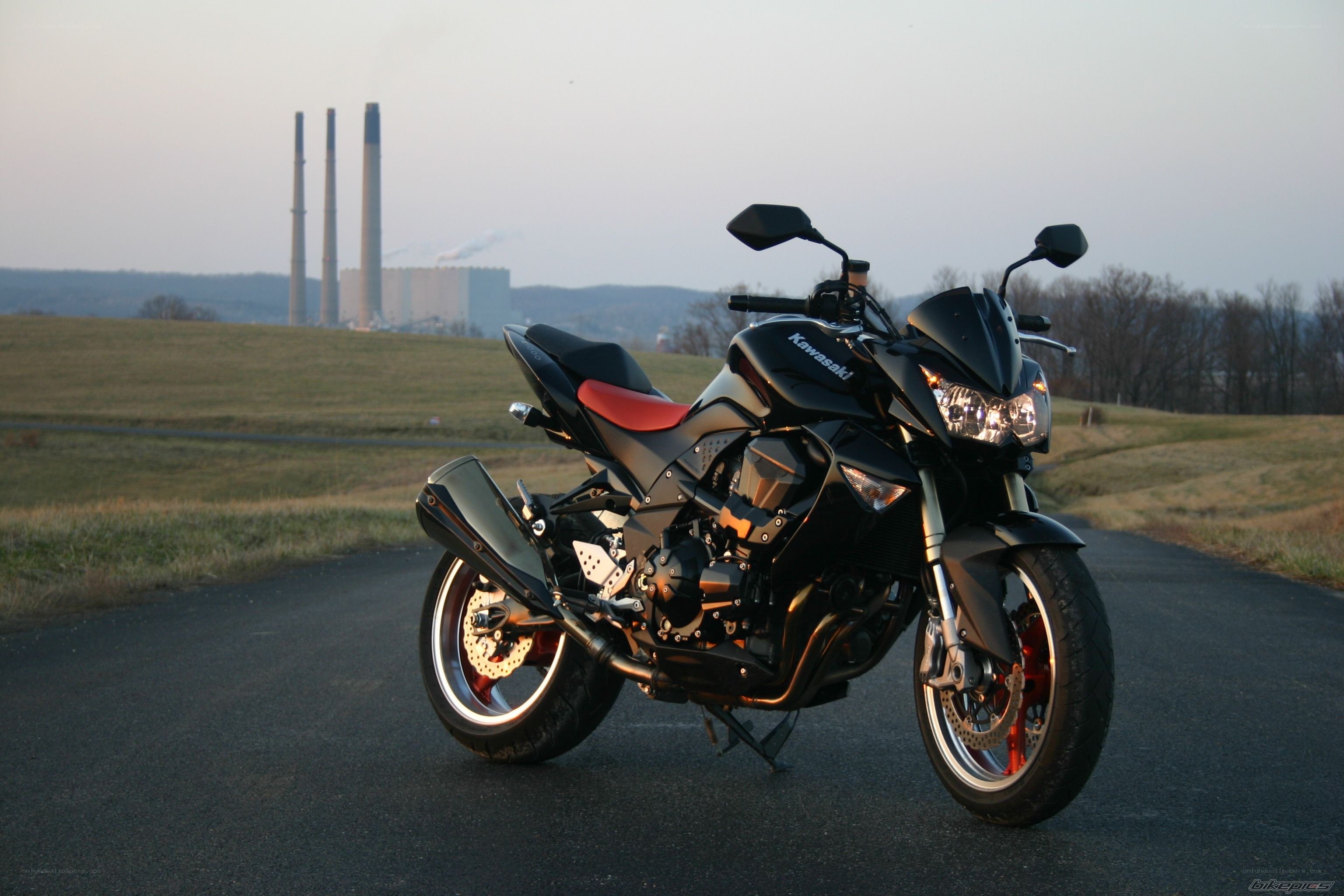 Black Kawasaki motorcycle on road