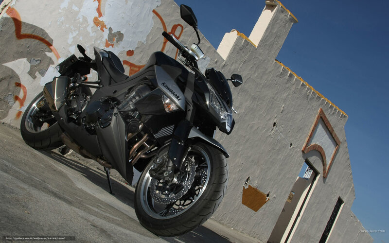 Black Kawasaki motorcycle on street