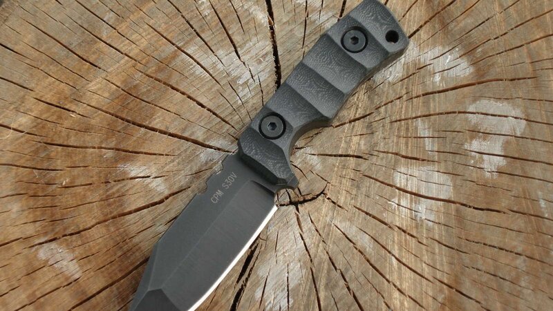 black knife on wooden surface