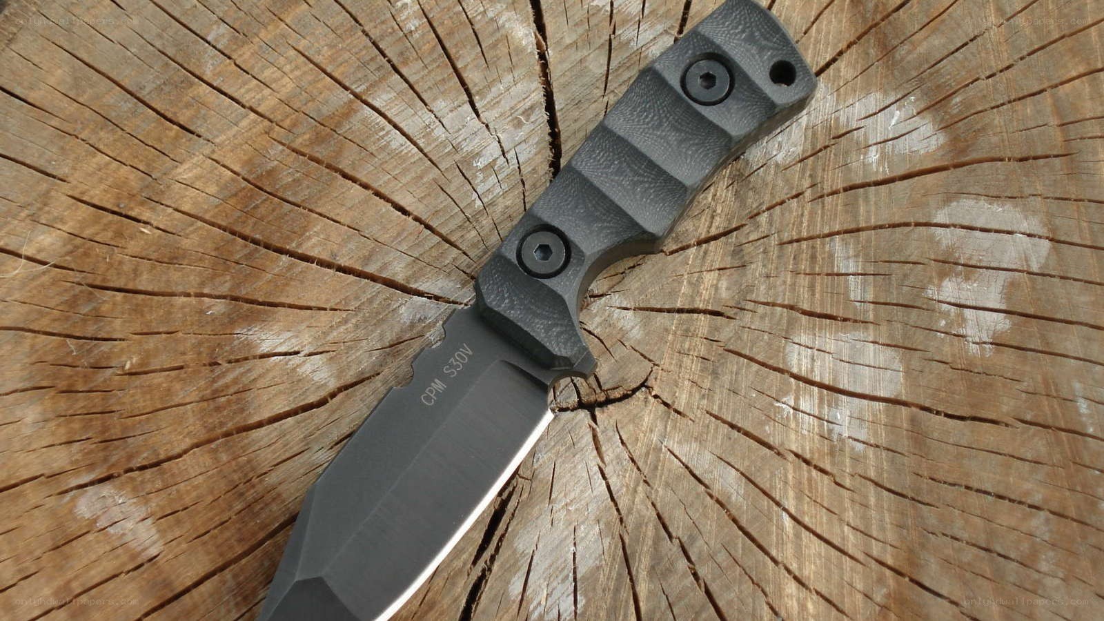 black knife on wooden surface