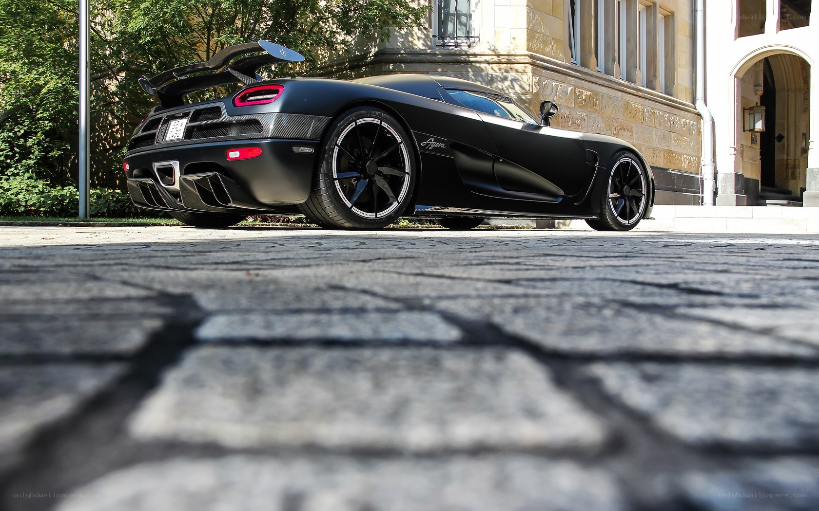 Black Koenigsegg Agera on cobblestones