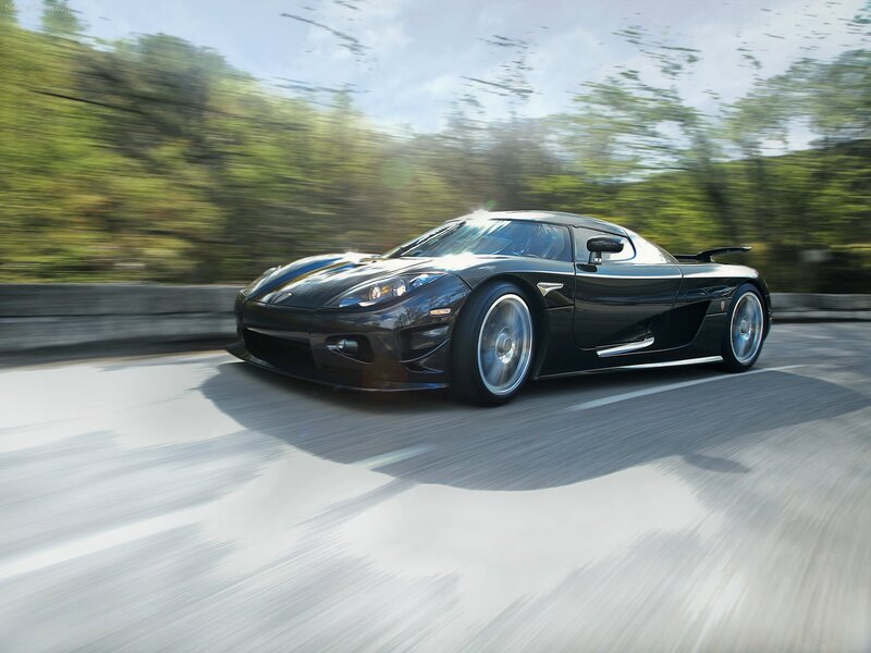 Black Koenigsegg on a road