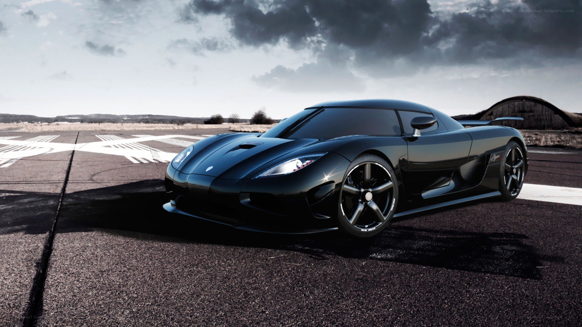Black Koenigsegg on runway