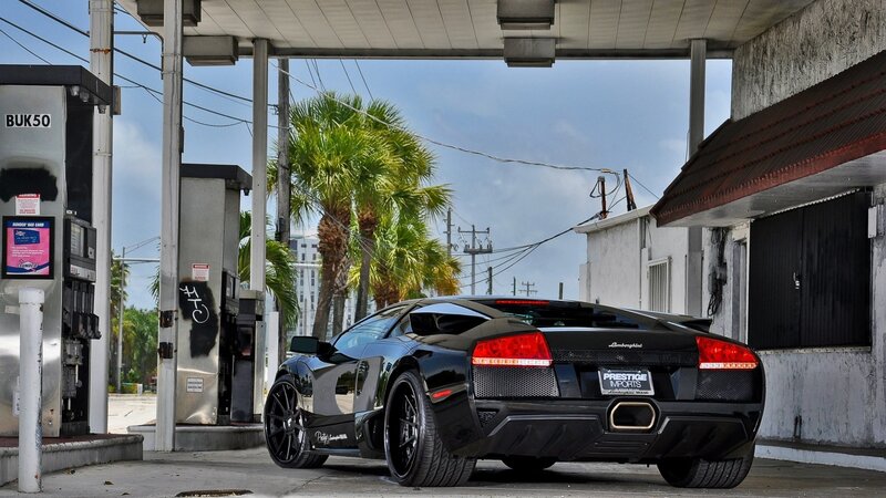 Black Lamborghini at gas station