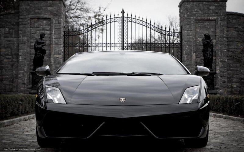 Black Lamborghini at stone gate
