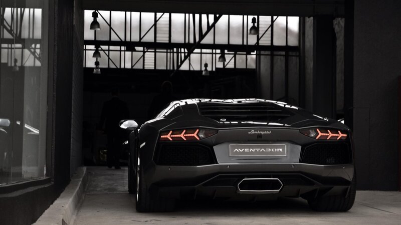 Black Lamborghini Aventador — Person