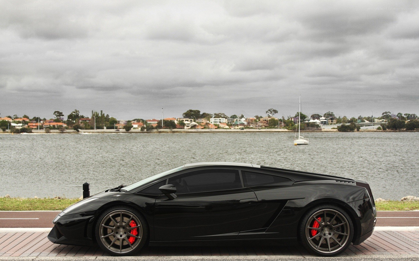Black Lamborghini by the water