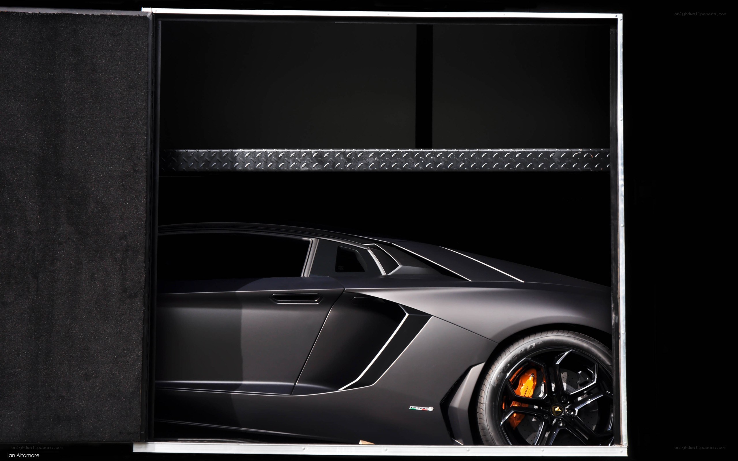 Black Lamborghini in a garage