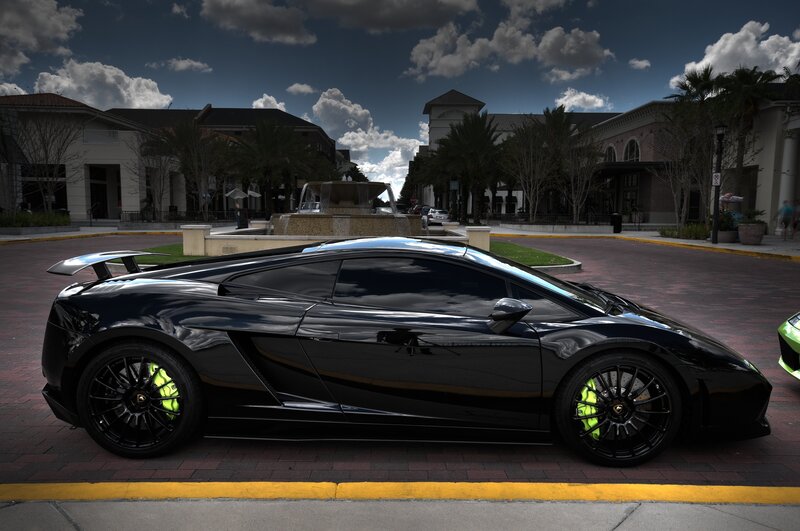 Black Lamborghini in a plaza