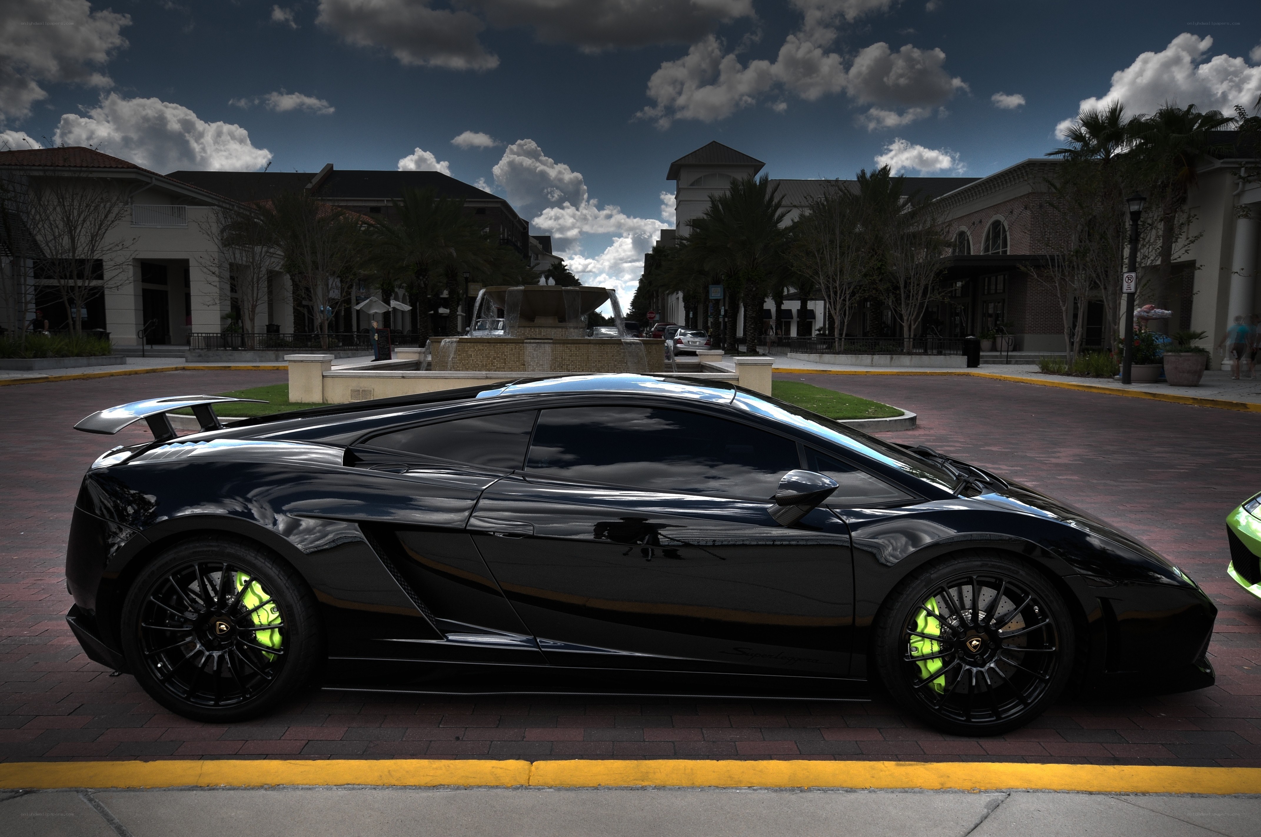 Black Lamborghini in a plaza