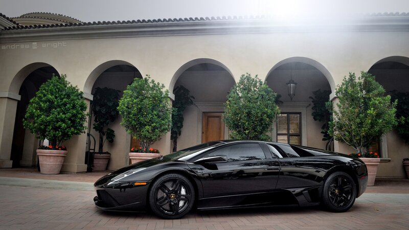 Black Lamborghini in courtyard