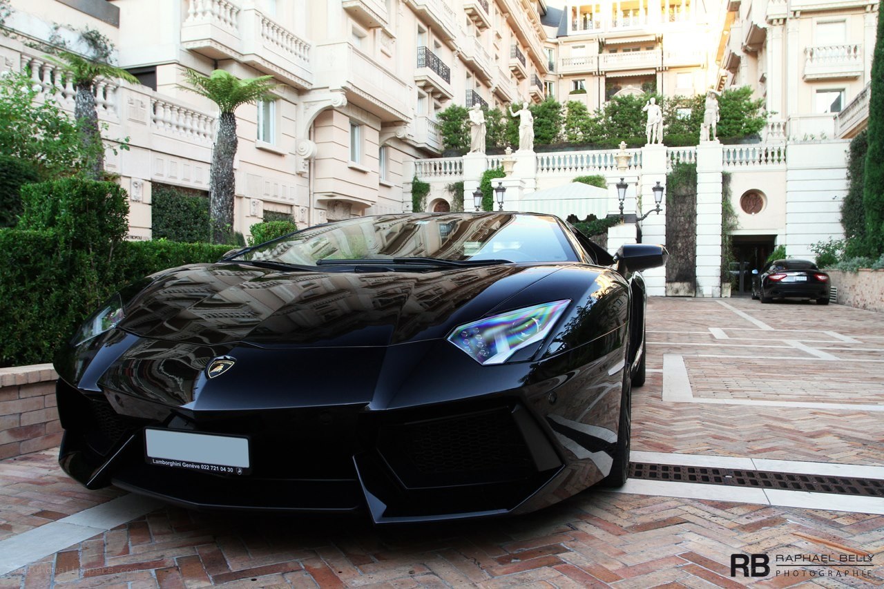 Black Lamborghini in courtyard