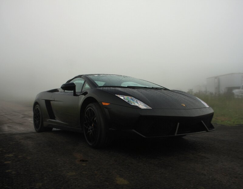 Black Lamborghini in fog