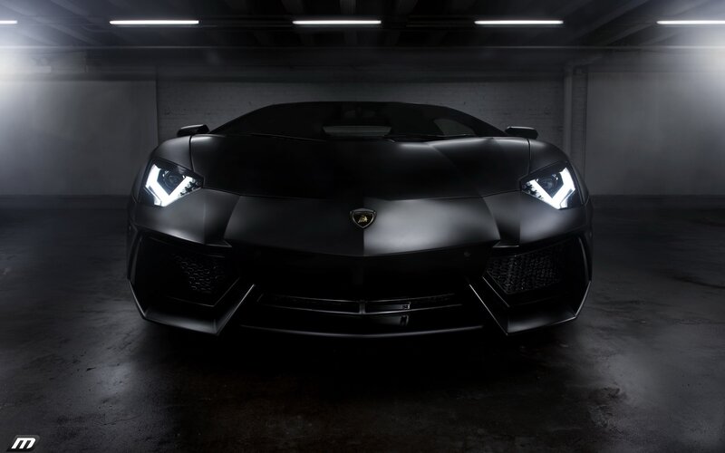 black lamborghini in garage