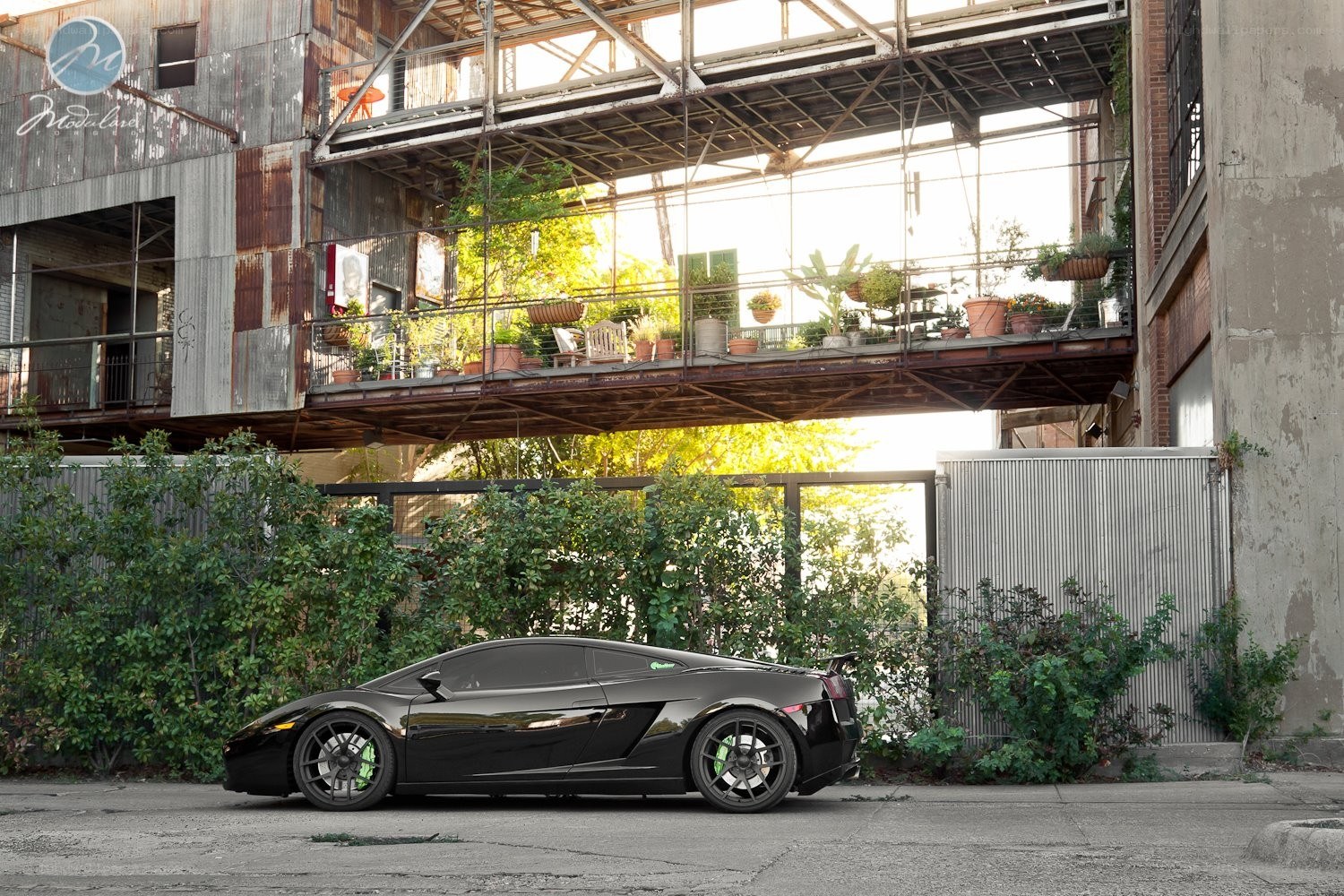 Black Lamborghini in industrial setting