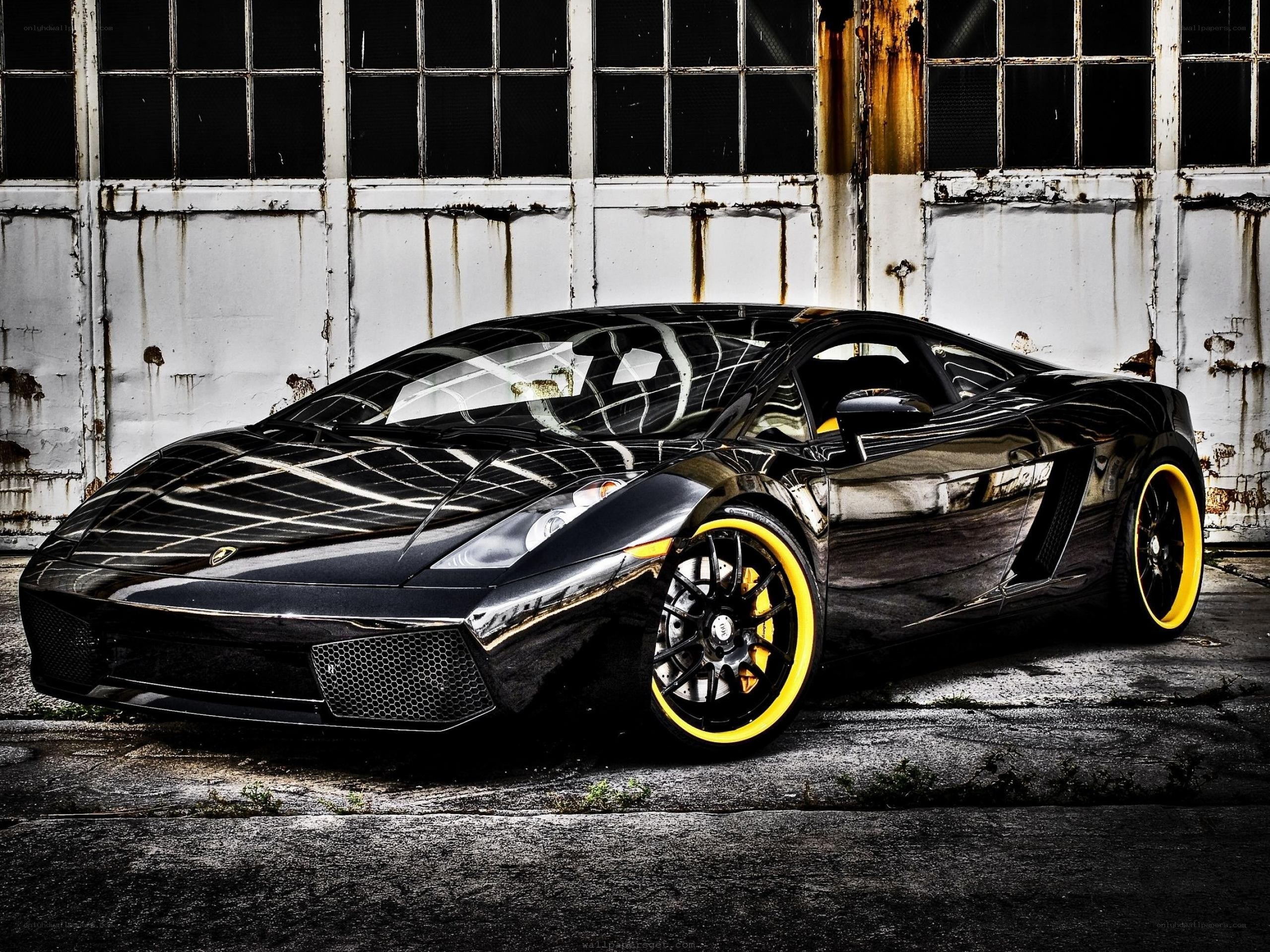 Black Lamborghini in industrial setting