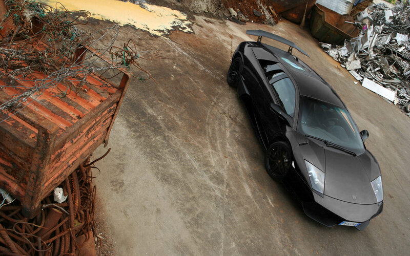 Black Lamborghini in junkyard