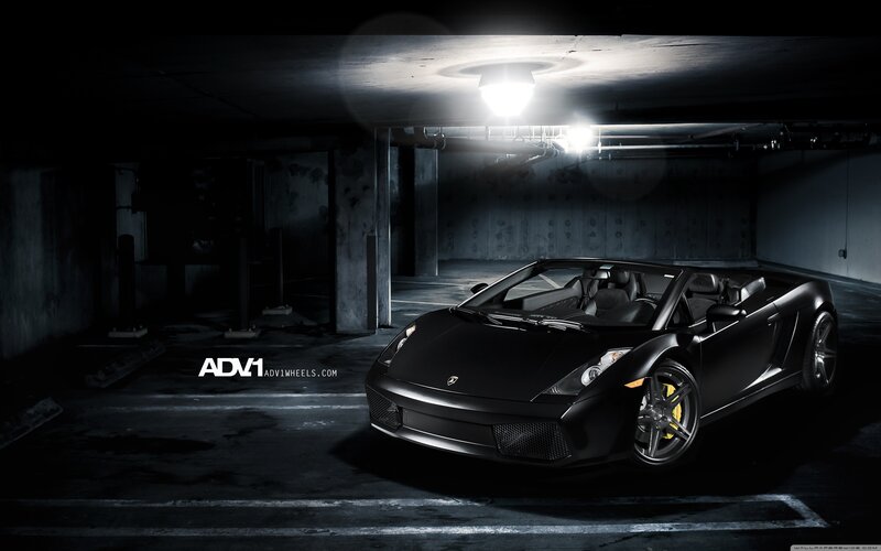 Black Lamborghini in parking garage
