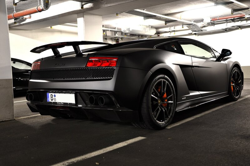Black Lamborghini in parking garage