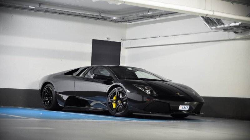 Black Lamborghini in parking garage