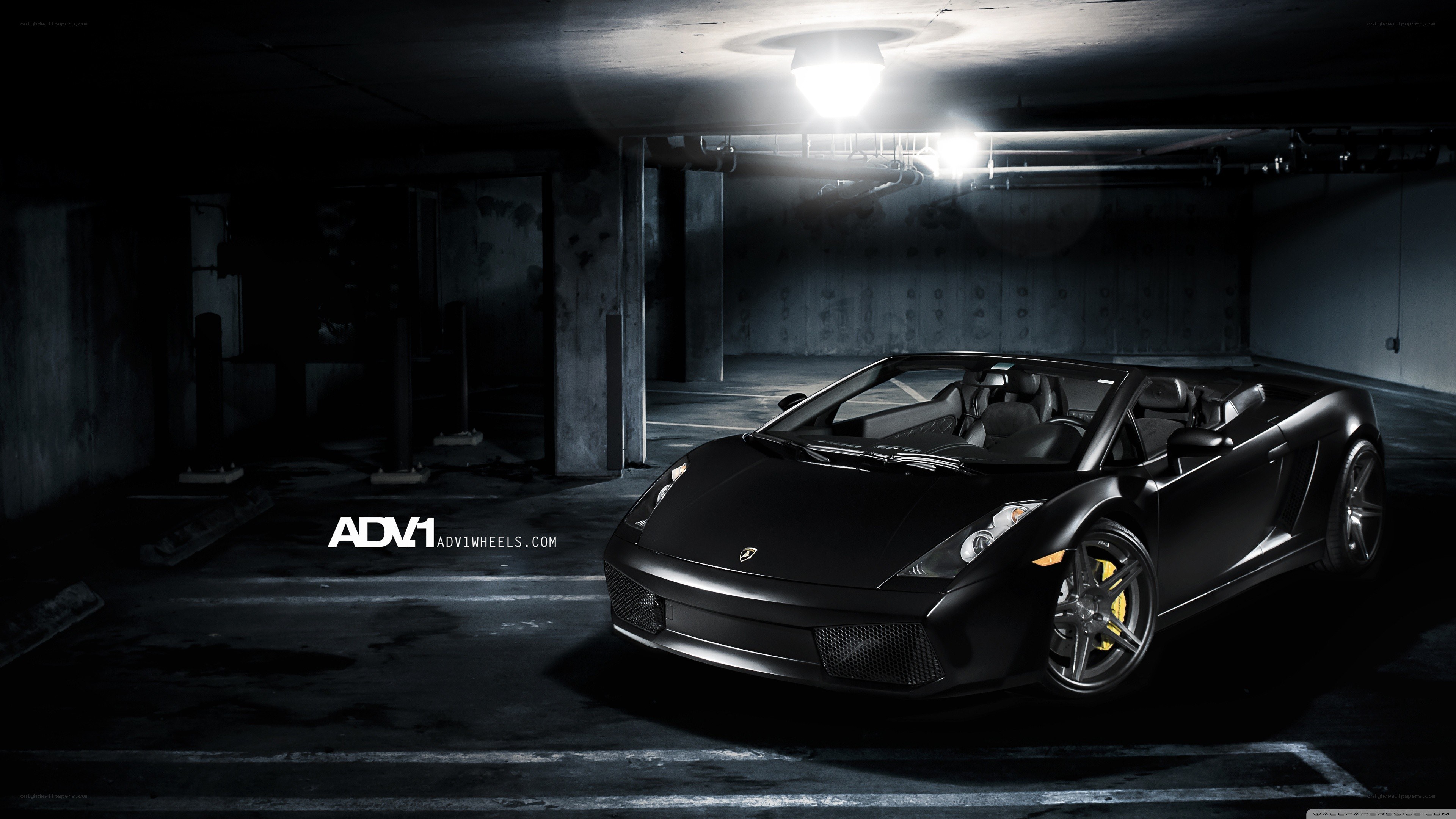 Black Lamborghini in parking garage